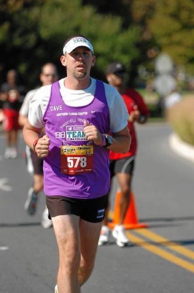 Running around a lakeside park in the Baltimore Marathon