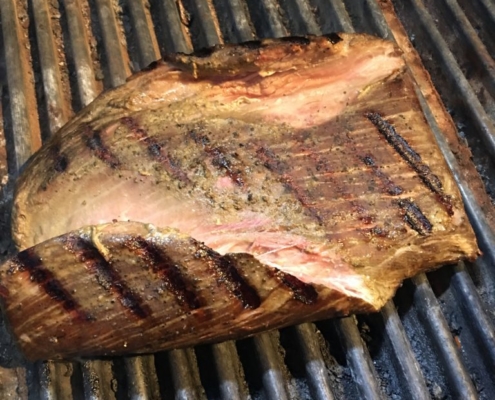 Flank steak searing on the grill