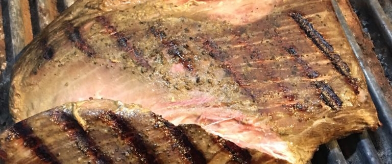 Flank steak searing on the grill