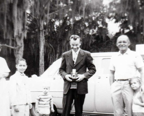 My grandfather holding a camera with his brother-in-law, c. 1959